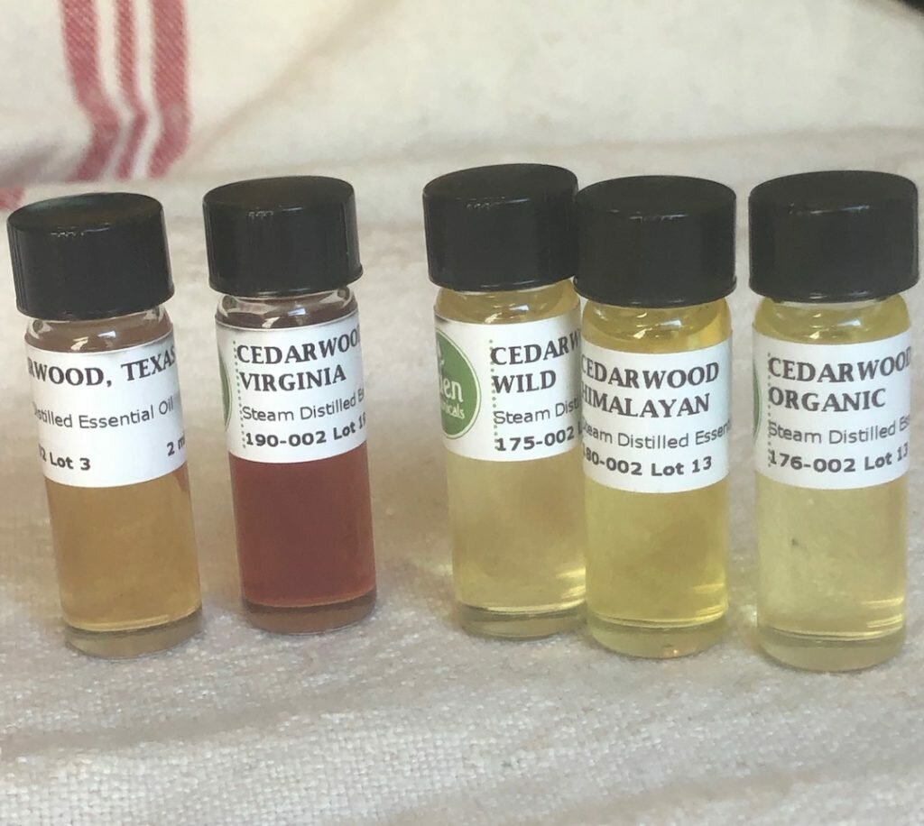 5 bottles of Cedar oil, both the darker Juniper and the true Cedar on the right.
